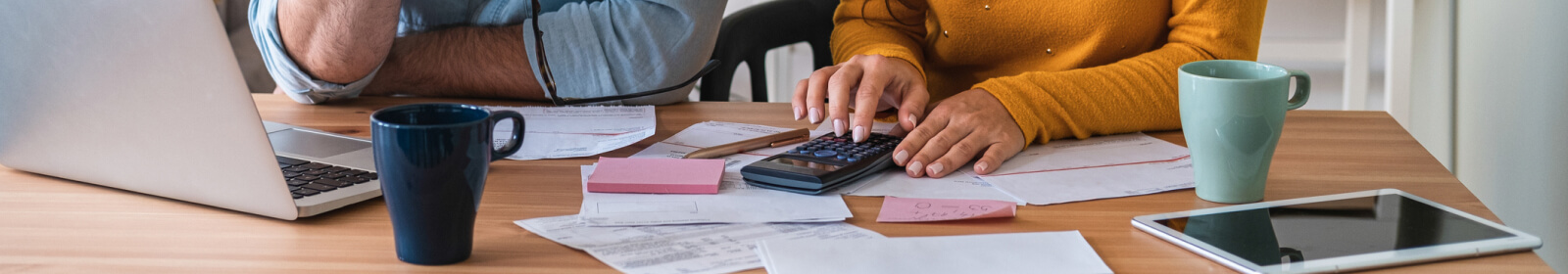 two people using a calculator